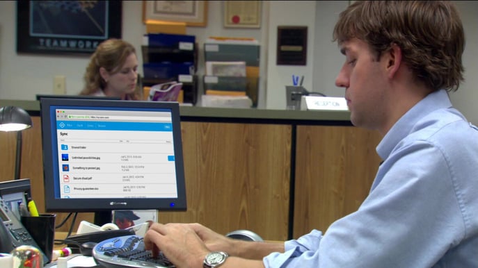 The Sync Web Panel superimposed on Jim Halpert's computer.